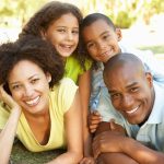 Portrait of Happy Family Piled Up In Park